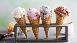 Four ice cream cones of various flavors