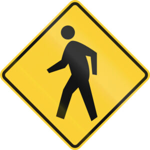 Yellow diamond-shaped sign with symbol of pedestrian