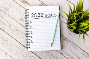 A notebook with 2022 goals written at the top